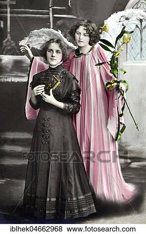 Stock Photo - Confirmation with angel, 1910s, handcoloured, Germany, Europe. Fotosearch