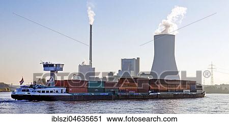 Container ship on the Rhine in front of the Duisburg-Walsum power station, Rheinberg, Lower Rhine, North Rhine-Westphalia, Germany, Europe View Large Photo Image Stock Image - Container ship on the Rhine in front of the Duisburg-Walsum power station, Rheinberg, Lower Rhine, North Rhine-Westphalia, Germany, Europe. Fotosearch