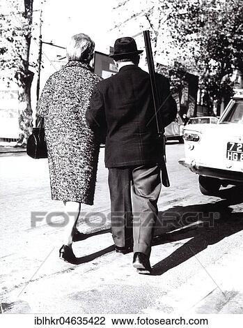Stock Image - Couple with rifle, between 50s and 60s, exact place unknown, France, Europe. Fotosearch