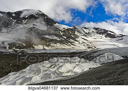 Covering of glacier ice with white plastic fleece to reduce glacier shrinkage in summer, skiing area Kaunertal Glacier, Kaunertal, Ötztaler Alps, Tyrol, Austria, Europe View Large Photo Image Stock Photo - Covering of glacier ice with white plastic fleece to reduce glacier shrinkage in summer, skiing area Kaunertal Glacier, Kaunertal, Ötztaler Alps, Tyrol, Austria, Europe. Fotosearch