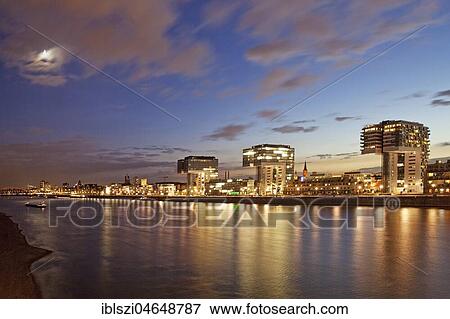 Crane houses with Rhine and Moon in the evening, Cologne, Rhineland, North Rhine-Westphalia, Germany, Europe View Large Photo Image Stock Photo - Crane houses with Rhine and Moon in the evening, Cologne, Rhineland, North Rhine-Westphalia, Germany, Europe. Fotosearch
