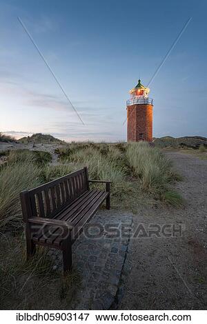 Stock Photo - Cross light, lighthouse with sand dune in the evening light, Kampen, Sylt, Germany, Europe. Fotosearch