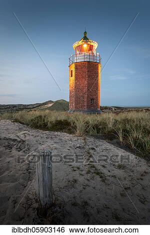 Stock Photograph - Cross light, lighthouse with sand dune in the evening light, Kampen, Sylt, Germany, Europe. Fotosearch