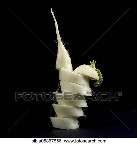 Stock Photograph - Cutting turnip, studio shot, France, Europe. Fotosearch