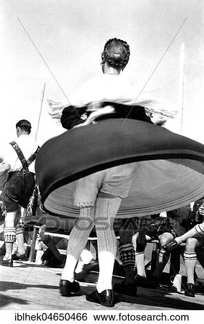 Dance in Bavarian traditional costume with view under the skirt, 1950s, Germany, Europe View Large Photo Image Stock Photograph - Dance in Bavarian traditional costume with view under the skirt, 1950s, Germany, Europe. Fotosearch