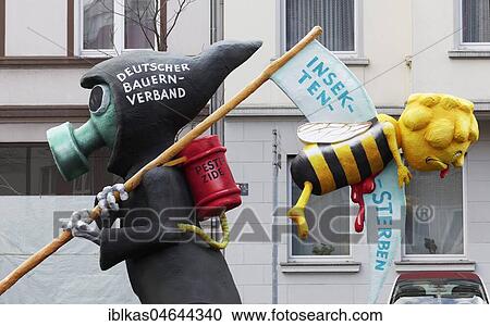 Death with gas mask, carries scythe with bee killed by pesticide, caricature to the insect's death, papier-mâché figurine, theme caravan Rosenmontagszug 2018, Düsseldorf, Nordrhein-Wetfalen, Germany, Europe View Large Photo Image Stock Image - Death with gas mask, carries scythe with bee killed by pesticide, caricature to the insect's death, papier-mâché figurine, theme caravan Rosenmontagszug 2018, Düsseldorf, Nordrhein-Wetfalen, Germany, Europe. Fotosearch