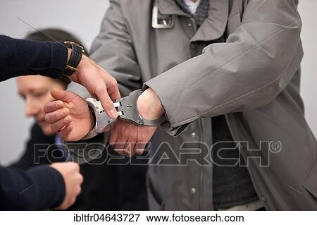 Defendant in trial for assault on a postal agency in Koblenz enters the courtroom in handcuffs, Koblenz Regional Court, Rhineland-Palatinate, Germany, Europe View Large Photo Image Stock Photo - Defendant in trial for assault on a postal agency in Koblenz enters the courtroom in handcuffs, Koblenz Regional Court, Rhineland-Palatinate, Germany, Europe. Fotosearch