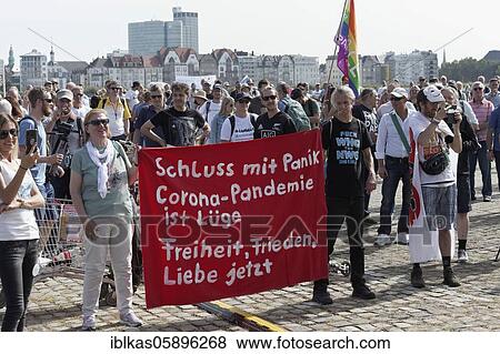 Stock Photo - Demo against corona rules on the Rhine meadows, corona rebels and lateral thinking supporters with banners, Düsseldorf, North Rhine-Westphalia, Germany, Europe. Fotosearch