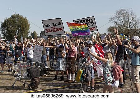 Stock Photo - Demo against corona rules on the Rhine meadows, corona rebels and lateral thinking supporters with banners, Düsseldorf, North Rhine-Westphalia, Germany, Europe. Fotosearch