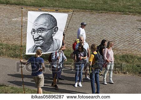 Demo against corona rules on the Rhine meadows, banner with portrait of Mahatma Gandhi, Düsseldorf, North Rhine-Westphalia, Germany, Europe View Large Photo Image Stock Photo - Demo against corona rules on the Rhine meadows, banner with portrait of Mahatma Gandhi, Düsseldorf, North Rhine-Westphalia, Germany, Europe. Fotosearch