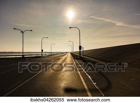 Die Landstrasse 305 in der Nahe des Eidersperrwerks bei Toning, Schleswig-Holstein, Deutschland, Europa View Large Photo Image Stock Photography - Die Landstrasse 305 in der Nahe des Eidersperrwerks bei Toning, Schleswig-Holstein, Deutschland, Europa. Fotosearch