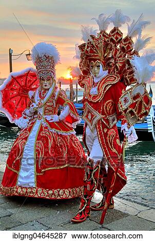 Disguised couple with Venetian masks on the lagoon, carnival in Venice, Italy, Europe View Large Photo Image Stock Photo - Disguised couple with Venetian masks on the lagoon, carnival in Venice, Italy, Europe. Fotosearch