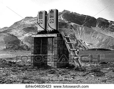 Stock Image - Dispensers without street, between 50s and 60s, exact location unknown, France, Europe. Fotosearch