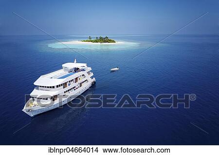 Diving safari ship MS Keana off an uninhabited palm island, Ari Atoll, Indian Ocean, Maldives, Asia View Large Photo Image Picture - Diving safari ship MS Keana off an uninhabited palm island, Ari Atoll, Indian Ocean, Maldives, Asia. Fotosearch
