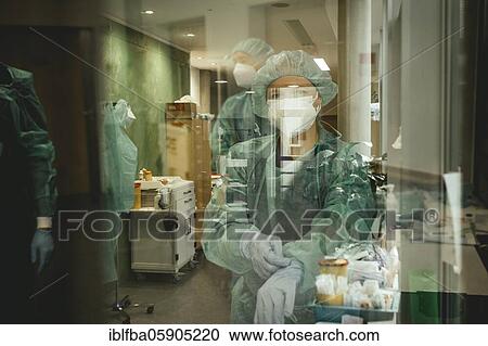 Stock Image - Doctors in front of entering the Covid ward, admission of a corona patient, Hospital Agatharied, Bavaria, Germany, Europe. Fotosearch