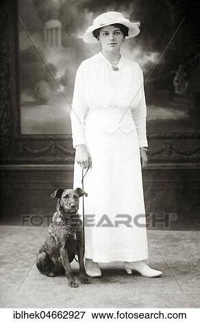 Dog next to woman in white dress, 1930s, Germany, Europe View Large Photo Image Stock Photo - Dog next to woman in white dress, 1930s, Germany, Europe. Fotosearch