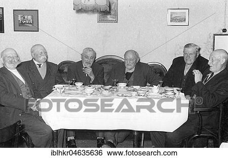 Stock Photograph - Eight senior citizens drinking coffee, 1950s, exact location unknown, Germany, Europe. Fotosearch