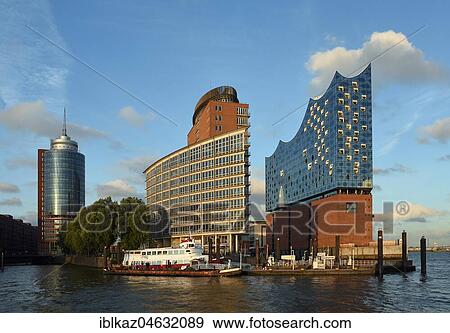 Elbe Philharmonic Hall and Hanseatic Trade Center Tower in the evening light, architects Herzog & De Meuron, Hafencity, Hamburg, Germany, Europe View Large Photo Image Stock Photo - Elbe Philharmonic Hall and Hanseatic Trade Center Tower in the evening light, architects Herzog & De Meuron, Hafencity, Hamburg, Germany, Europe. Fotosearch
