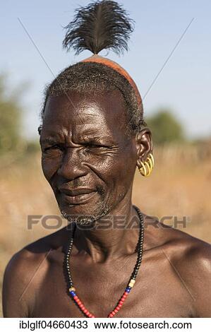 Stock Image - Elderly man with hair ornaments, portrait, Hamer tribe, Turmi market, Southern Nations Nationalities and Peoples' Region, Ethiopia, Africa. Fotosearch