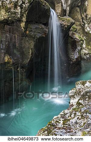 Stock Image - Emerald green wild river Soca flows through rocky gorge, Socatal, Slovenia, Europe. Fotosearch