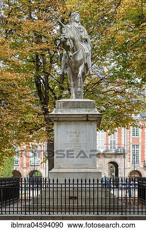 Stock Image - Equestrian statue of King Louis XIII, Place des Vosges, Paris, France, Europe. Fotosearch