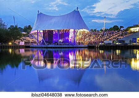 Event at the Amphitheater on Rhine-Herne-Canal, evening mood, Nordsternpark, Gelsenkirchen, Ruhr Area, North Rhine-Westphalia, Germany, Europe View Large Photo Image Stock Photo - Event at the Amphitheater on Rhine-Herne-Canal, evening mood, Nordsternpark, Gelsenkirchen, Ruhr Area, North Rhine-Westphalia, Germany, Europe. Fotosearch