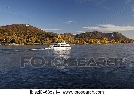 Excursion boat on Rhine with Petersberg and Drachenfels, Siebengebirge, Königswinter, North Rhine-Westphalia, Germany, Europe View Large Photo Image Picture - Excursion boat on Rhine with Petersberg and Drachenfels, Siebengebirge, Königswinter, North Rhine-Westphalia, Germany, Europe. Fotosearch