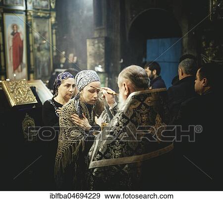 Exorcism during an Orthodox Mass in the Church, well-known Eorcist Father Sergei receives people from Russia who think they are possessed by the devil, Okhamchira, Abkhazia, Georgia, Asia View Large Photo Image Stock Photo - Exorcism during an Orthodox Mass in the Church, well-known Eorcist Father Sergei receives people from Russia who think they are possessed by the devil, Okhamchira, Abkhazia, Georgia, Asia. Fotosearch