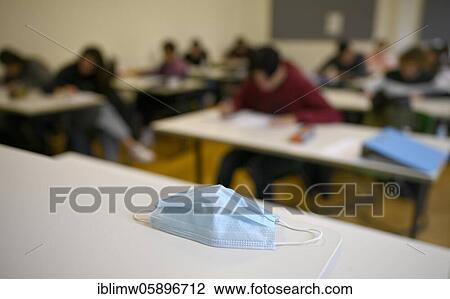 Face mask on student's desk, attendance lessons, corona crisis, Stuttgart, Baden-Württemberg, Germany, Europe View Large Photo Image Stock Image - Face mask on student's desk, attendance lessons, corona crisis, Stuttgart, Baden-Württemberg, Germany, Europe. Fotosearch