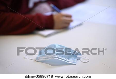 Stock Photo - Face mask on student's desk, attendance lessons, corona crisis, Stuttgart, Baden-Württemberg, Germany, Europe. Fotosearch