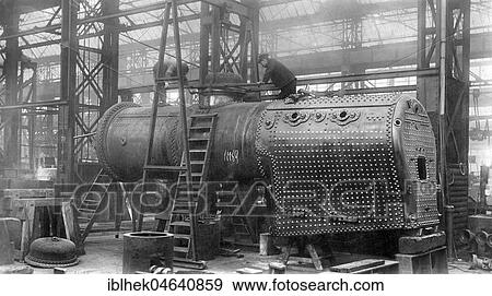 Stock Photo - Factory hall, steel industry, mechanical engineering, workers build a locomotive, 1910s, Borsigwerke Berlin Tegel, Germany, Europe. Fotosearch