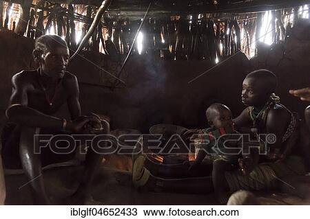 Family sits in mud hut, hamer tribe, Turmi, region of southern nations, Ethiopia, Africa View Large Photo Image Stock Image - Family sits in mud hut, hamer tribe, Turmi, region of southern nations, Ethiopia, Africa. Fotosearch