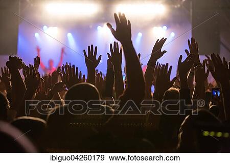 Fans in the audience cheering during the concert of the German-Lebanese rapper MoTrip live at the Schüür, Lucerne, Switzerland, Europe View Large Photo Image Stock Photo - Fans in the audience cheering during the concert of the German-Lebanese rapper MoTrip live at the Schüür, Lucerne, Switzerland, Europe. Fotosearch
