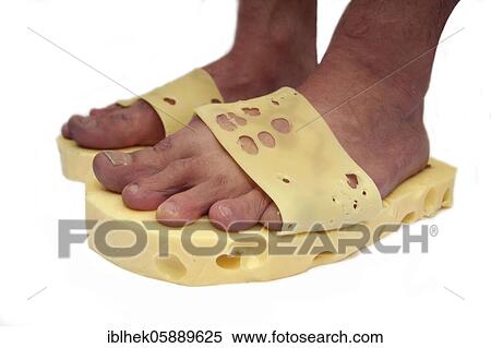 Stock Photography - Fashion, cheese feet, sandals made of Emmental cheese, Berlin Germany. Fotosearch