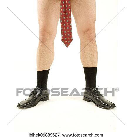Stock Photo - Fashion, men's fashion, tasteless, man hangs tie between legs, Berlin, Germany, Europe. Fotosearch