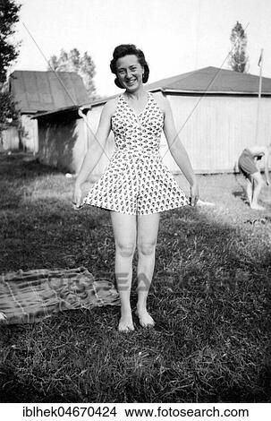 Picture - Fashion, Woman proudly shows her summer dress, 1940s, Germany, Europe. Fotosearch