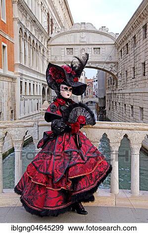 Female disguised with Venetian mask in front of Bridge of Sighs, Carnival in Venice, Italy, Europe View Large Photo Image Stock Photo - Female disguised with Venetian mask in front of Bridge of Sighs, Carnival in Venice, Italy, Europe. Fotosearch