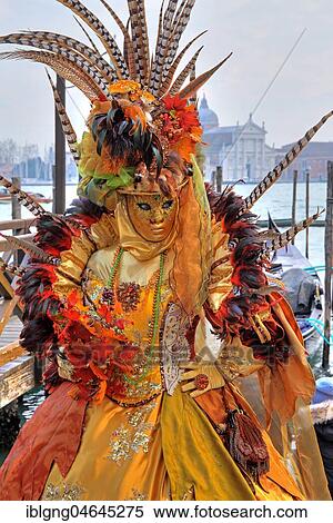 Stock Photography - Female disguised with Venetian mask, in the back island San Giorgio, carnival in Venice, Italy, Europe. Fotosearch