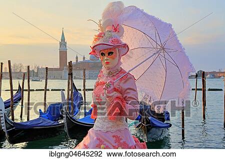 Female disguised with Venetian mask on the lagoon, behind island of San Giorgio, carnival in Venice, Italy, Europe View Large Photo Image Stock Image - Female disguised with Venetian mask on the lagoon, behind island of San Giorgio, carnival in Venice, Italy, Europe. Fotosearch