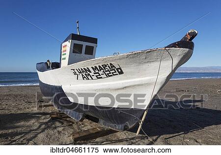 Fishing boat at the San Miguel beach, San Miguel de Cabo de Gata, Nature Reserve Cabo de Gata-Nijar, Almeria province, Andalusia, Spain, Europe View Large Photo Image Stock Photography - Fishing boat at the San Miguel beach, San Miguel de Cabo de Gata, Nature Reserve Cabo de Gata-Nijar, Almeria province, Andalusia, Spain, Europe. Fotosearch