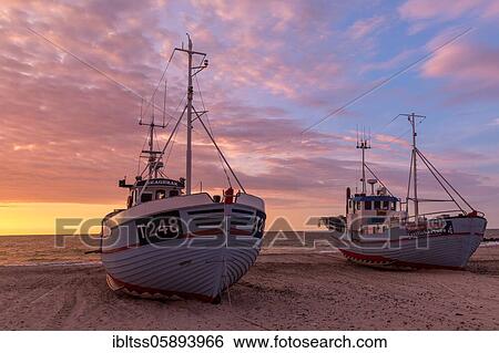 Stock Photograph - Fishing boats at sunset at the port of Vorupör, Region Nordjylland, Denmark, Europe. Fotosearch