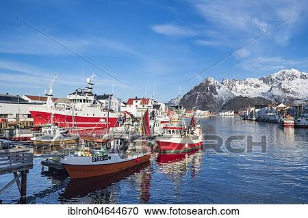 Stock Image - Fishing boats in the port of Henningsvaer, Lofoten, Norway, Europe. Fotosearch