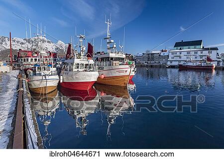 Stock Image - Fishing boats in the port of Henningsvaer, Lofoten, Norway, Europe. Fotosearch