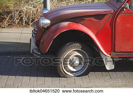 Flat tire on vintage car, Citroen 2CV Ente, Germany, Europe View Large Photo Image Stock Image - Flat tire on vintage car, Citroen 2CV Ente, Germany, Europe. Fotosearch