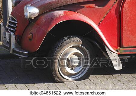 Flat tire on vintage car, Citroen 2CV Ente, Germany, Europe View Large Photo Image Stock Image - Flat tire on vintage car, Citroen 2CV Ente, Germany, Europe. Fotosearch
