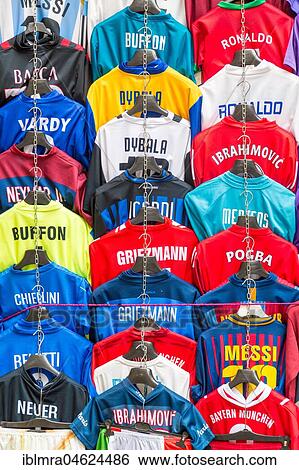 Stock Photograph - Football jerseys with names of football players for sale at sales stall, Florence, Italy, Europe. Fotosearch