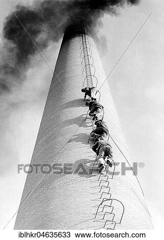 Stock Image - Four men climb up a chimney in a row, 1950s, exact location unknown, Germany, Europe. Fotosearch