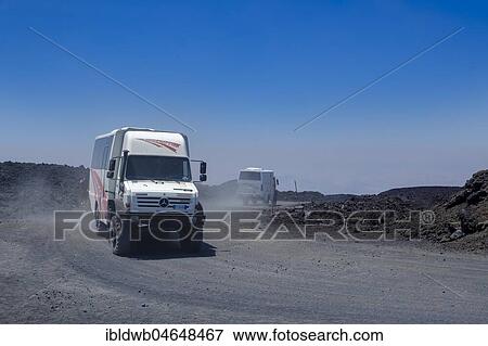 Four-wheel drive vehicles on gravel road to Etna volcano, province of Catania, Silzilia, Italy, Europe View Large Photo Image Stock Photo - Four-wheel drive vehicles on gravel road to Etna volcano, province of Catania, Silzilia, Italy, Europe. Fotosearch