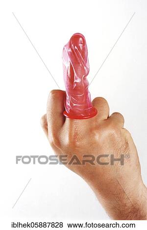 Stock Photo - Fuck you, parody, middle finger with condom, Berlin, Germany, Europe. Fotosearch