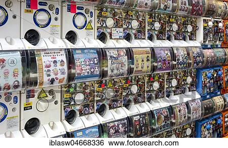 Stock Photograph - Gachapon machines with toys in small capsules on the electronics mile Akihabara, Tokyo, Japan, Asia. Fotosearch
